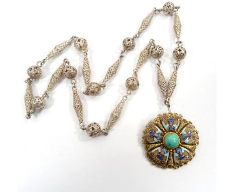 UNUSUAL SILVER CHAINwith pierced links; and an attached silver gilt brooch/pendant with enamel decoration 