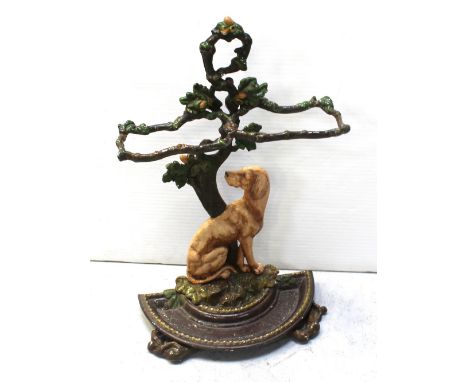 A painted cast iron stick/umbrella stand modelled as a hound beneath an oak tree with semi-circular drip tray, height approx 