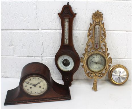 An early 20th century carved oak barometer/thermometer (glass af), a decorative example and a ship's style barometer, also an