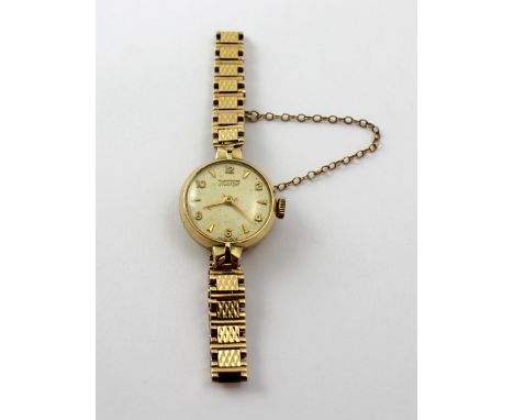 Tissot; a ladies' 9ct yellow gold cased mechanical cocktail watch, the circular dial set with Arabic and baton numerals, diam