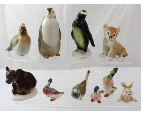 Five Russian animal and bird figures to include penguin, bear and birds, a Royal Dux figure of a penguin, a set of three Besw