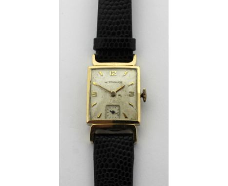 Wittnauer; a c1940s gentlemen's tank-style watch, gold filled case, the cream painted dial set with gold filled Arabic and ba
