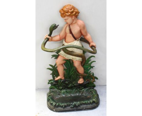 A painted cast iron figural stick/umbrella stand modelled as a young Hercules wrestling a snake with foliate detail to tray, 