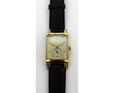 Longines; a 1960s gentlemen's tank style watch, gold filled case, the white painted dial with applied gold filled Arabic and 