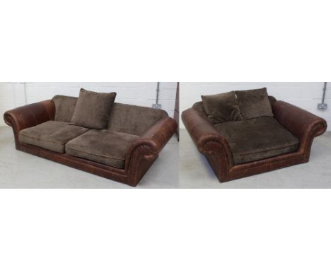 A brown leather and material three-seater roll-arm sofa, length 230cm and a matching two-seater example (2).