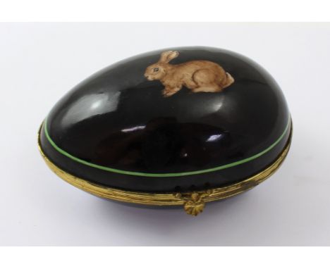 A Gallec of Paris hand-decorated egg-shaped porcelain trinket box, black ground with rabbit design, inscribed to base, 6.5 x 
