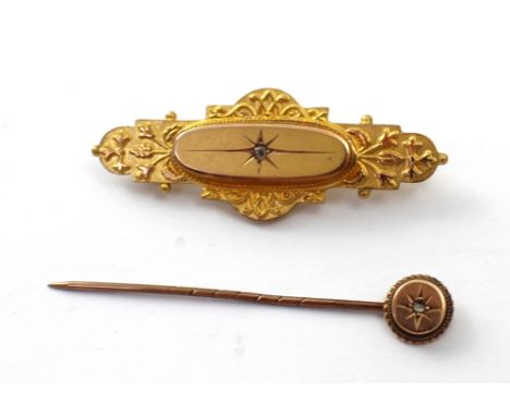 A 9ct gold Victorian bar mourning brooch set with small diamond and a yellow metal stick pin set with small white stone, comb