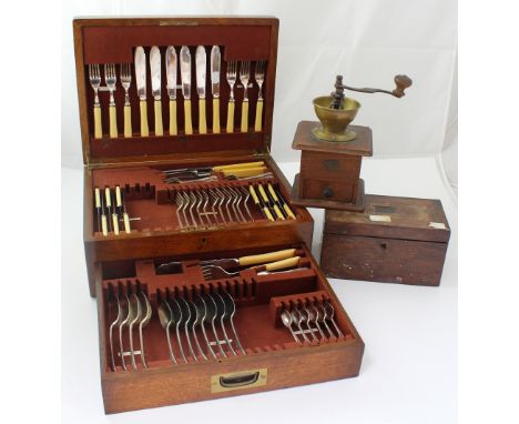An early 20th century oak-cased canteen of flatware with partial contents, 41 x 31cm, a rosewood twin compartment tea caddy w