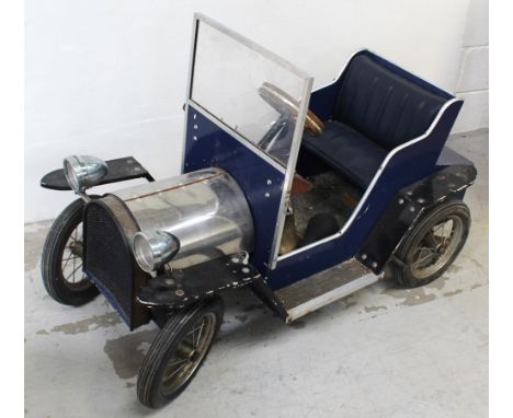 A children's model car, vintage-style open-top roadster car with blue leather seat to interior, inset dashboard brass soundin