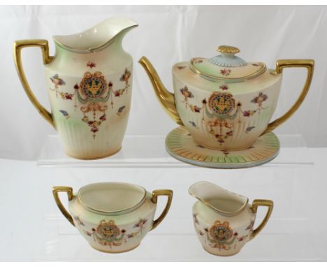 An early 20th century Crown Ducal five-piece tea service comprising teapot and stand, milk jug, sugar bowl and hot water jug 