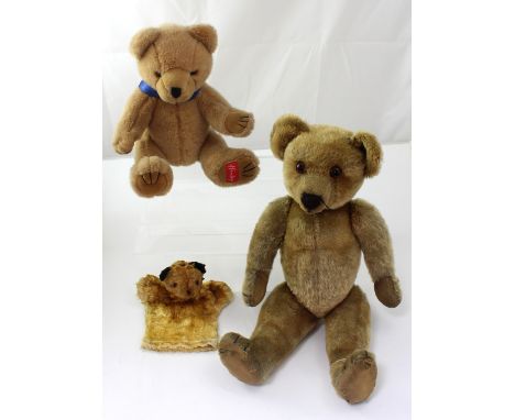 A Hamleys teddy bear with label to the foot, a vintage Sooty glove puppet and a c1940s straw-filled articulated teddy bear wi