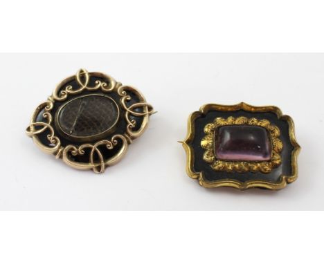 Two yellow metal Victorian mourning brooches, a rectangular example with black enamel within a yellow metal scrolling mount a