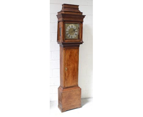 A mid-to-late 18th century oak longcase clock, the caddy top with chinoiserie frieze decoration above an 11" brass dial with 