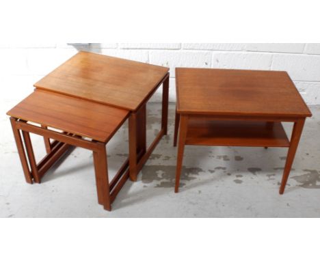 A retro nest of three teak tables on 'D' end supports, and a small rectangular coffee table with lower shelf, on tapering sup