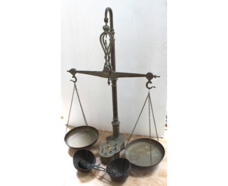 A pair of vintage brass weighing scales, with weighing pans and various weights, height approx 82cm.