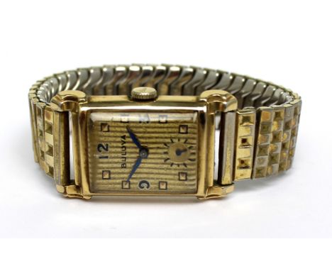 Bulova; a 1949 gentlemen's 'Academy Award' tank-style wristwatch, gold filled square case, the gold filled engine-turned dial