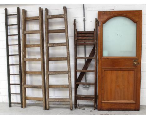 A large 20th century oak public house door with arched frosted glass panel, 212 x 91cm, two vintage folding step ladders, a g