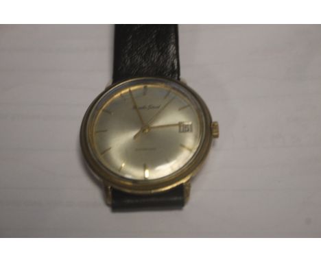 A VINTAGE BUECHE GIROD GENTLEMAN'S AUTOMATIC WRISTWATCH ON LEATHER STRAP