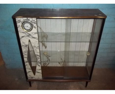 A CHINA DISPLAY CABINET WITH INTEGRAL CLOCK