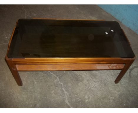 A REAK RETRO COFFEE TABLE WITH SMOKED GLASS TOP AND A STRETCHER SHELF