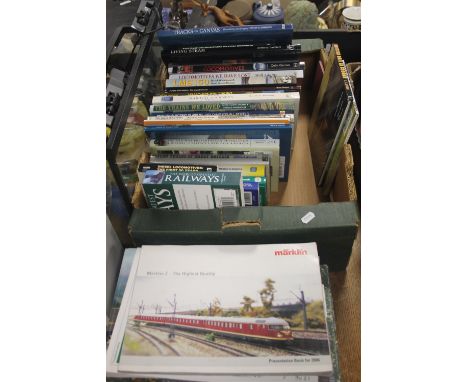 A TRAY OF RAILWAY INTEREST BOOKS TOGETHER WITH A COLLECTION OF MARKLIN CATALOGUES (TRAYS NOT INCLUDED)