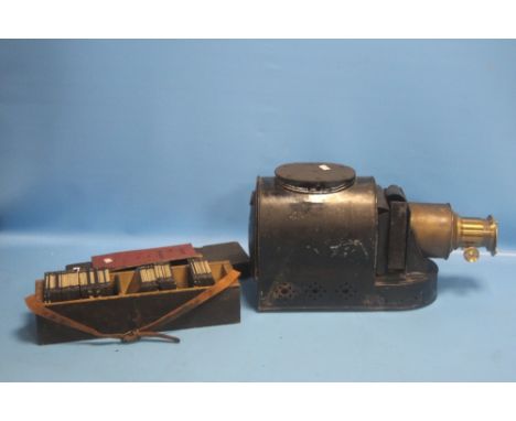 AN ANTIQUE W. C. HUGHES MAGIC LANTERN ALONG WITH A BOXED SET OF MAINLY NAVY &amp; MILITARY INTEREST SLIDES INCLUDING THE FIRI