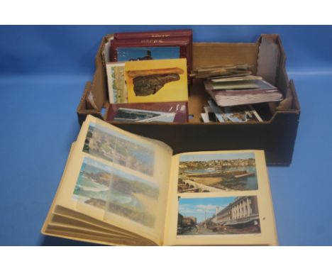VINTAGE POSTCARDS IN ALBUMS AND LOOSE, SUBJECTS INCLUDE WALES, THE WIRRAL, LONDON ETC.