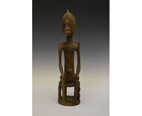 Ethnographica - African tribal maternity figure, Bena Lulua, Congo, modelled seated upon a stool with hands to knees, all-ove