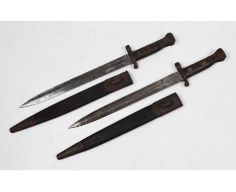 Two pattern 1888 bayonets, with double ended 12" blades with ordnance markings, one by Mole, in their leather scabbards with 