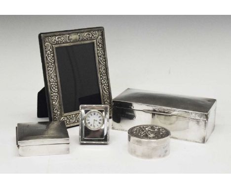 Assorted group of silver comprising; Elizabeth II silver-fronted photo frame, 12cm x 8.5cm, two table top boxes, Asian white 