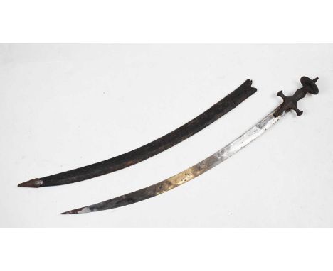 An Indian sword 'Tulwar' (or 'Talwar'), with a single edged curved 30" blade, iron hilt with a disc-shaped pommel, in its lea