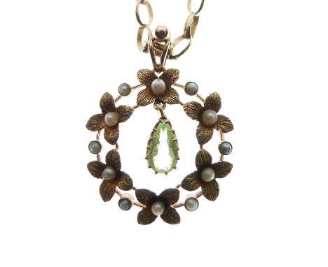 Edwardian yellow metal, seed pearl and peridot pendant, with pendeloque-cut peridot drop within floral wreath of textured pet