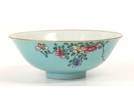 A Chinese Porcelain Bowl, Qing Dynasty, turquoise ground with sgraffito scrollwork feathers, painted in famille rose enamels 