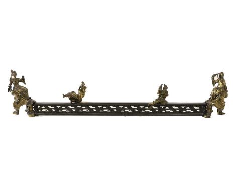 A Late 19th Century French Brass and Steel Fire Curb, the pierced fender surmounted by two figures playing muscial instrument
