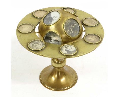 A Victorian Brass Betjemann-Type Photograph Holder, in the form of a globe within a ring on a knopped stem and conical foot21