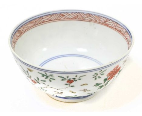 A Chinese Porcelain Bowl, Chenghua reign mark but 18th century, decorated in Wucai enamels with flowers between underglaze bl