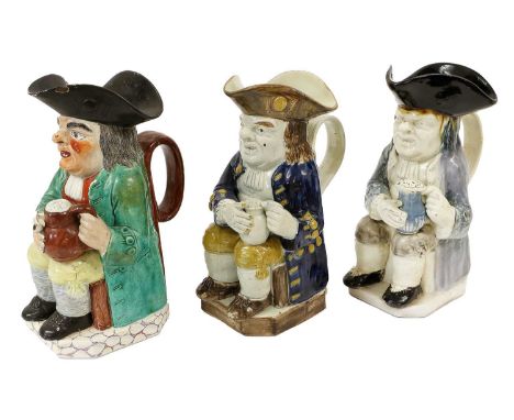 A Pearlware Toby Jug, early 19th century, probably Neale &amp; Co. decorated in colourful glazes, modelled holding a pipe and