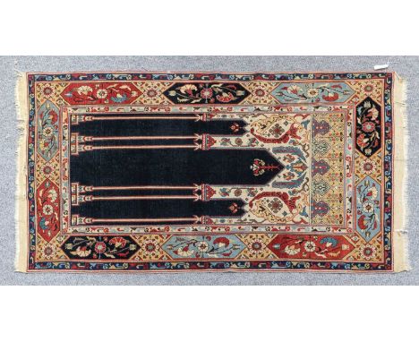Tuduc Prayer RugRomania, circa 1900The indigo field with three angular niches, each with hanging lamp, flanked by six columns