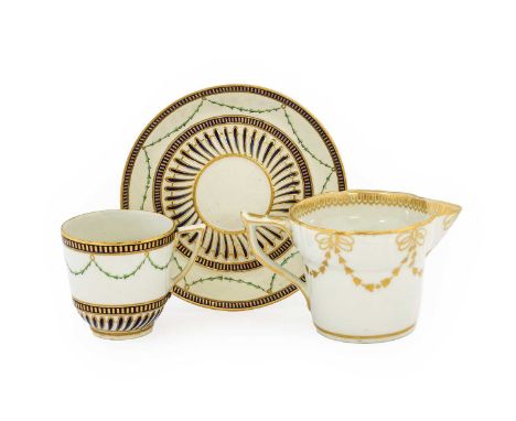 A Derby Porcelain Coffee Cup and Saucer, circa 1780, painted with green husk swags within underglaze blue and gilt borders ov