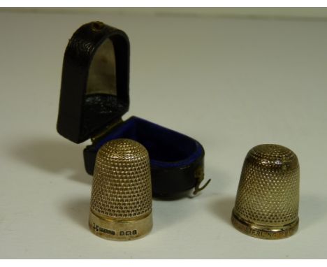 A silver thimble, Birmingham 1910 in original leather covered case and together with a Sterling silver thimble "The Spa"