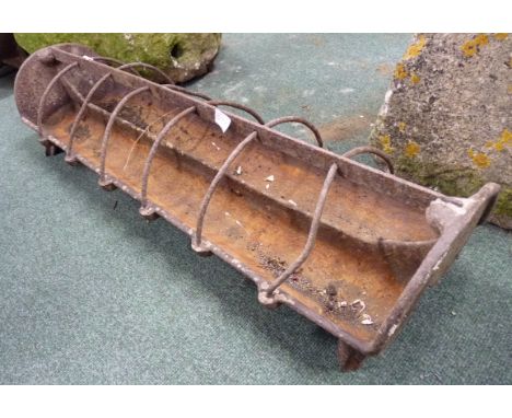 An old cast iron pig feeding trough 95cm long 