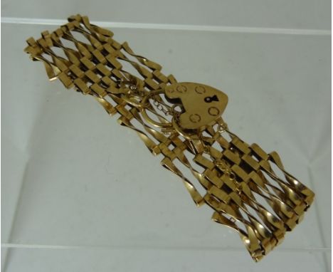 A 9ct gold six bar gate bracelet with padlock clasp 12.3g approx