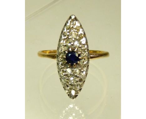 A ladies 18ct gold and platinum set diamond and sapphire, marquis shaped ring.  The ring set with a central sapphire, with a 