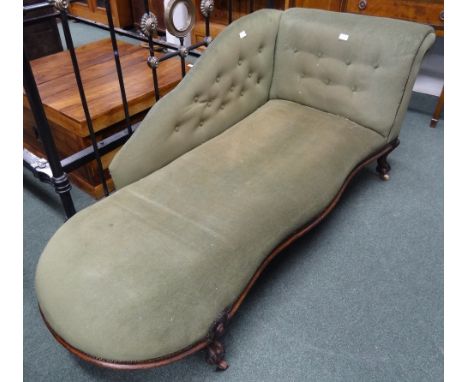 An early Victorian chaise longue, short mahogany scroll carved legs, with ceramic castors, with button back upholstery.  181 