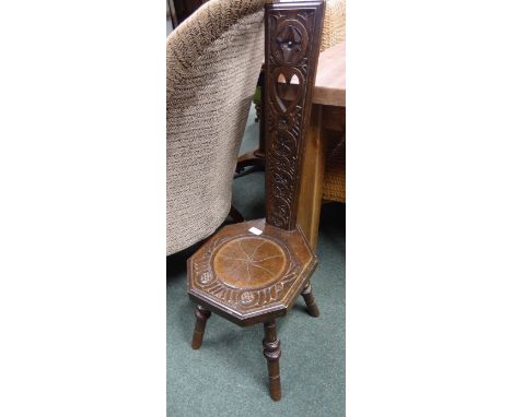 A late Victorian/early 20th Century spinning stool, of typical construction, the single back splat with cut out heart decorat