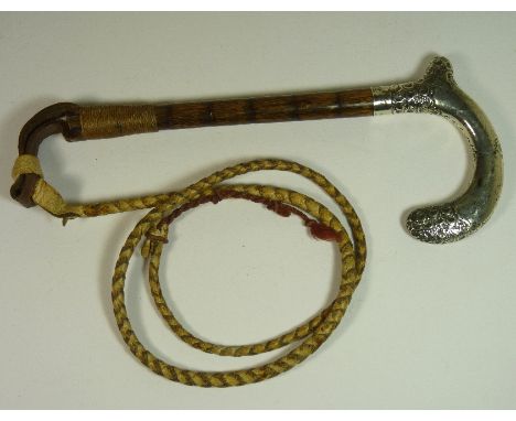 A George V silver handled Beagle whip, the curved handle with embossed decoration, Chester 1911, with bamboo shaft, plaited l