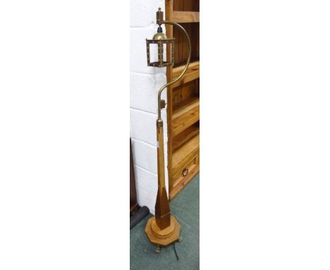 An ecclesiastical, art deco, altar lamp.  Fitted for electricity, on octagonal and circular step base with brass lion paw fee