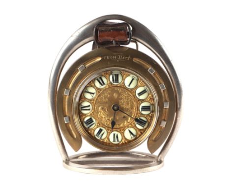 A stirrup desk clock with enamelled Roman numerals, 14cms diameter.