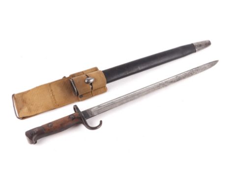 A Loyal Regiment (North Lancashire) 1907 pattern bayonet with hooked quillion, leather scabbard and canvas frog, 57cms long.