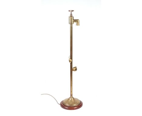 A novelty brass standard lamp, the light fitting incorporating a brass tap fitting, 110cms high.